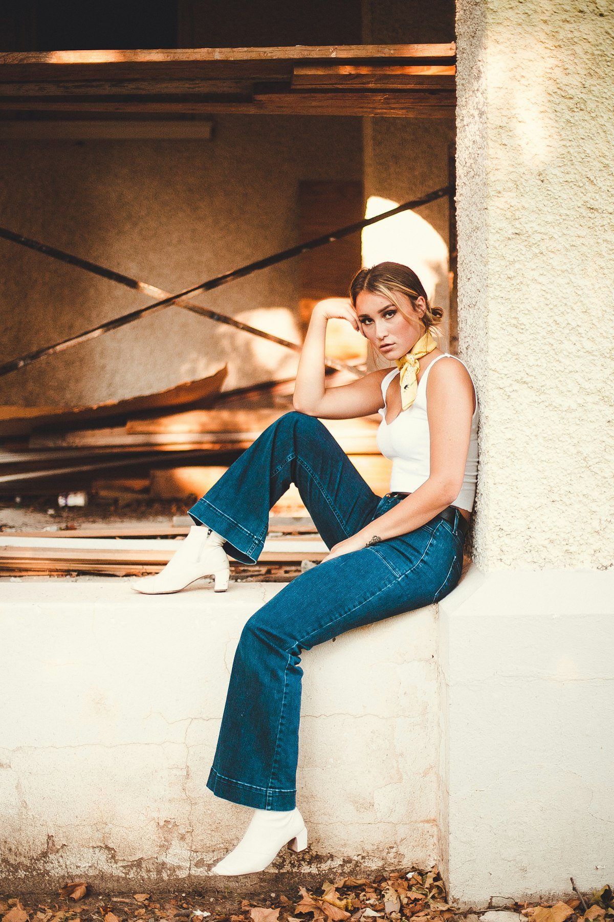 Woman in dark rinse high rise straight jeans
