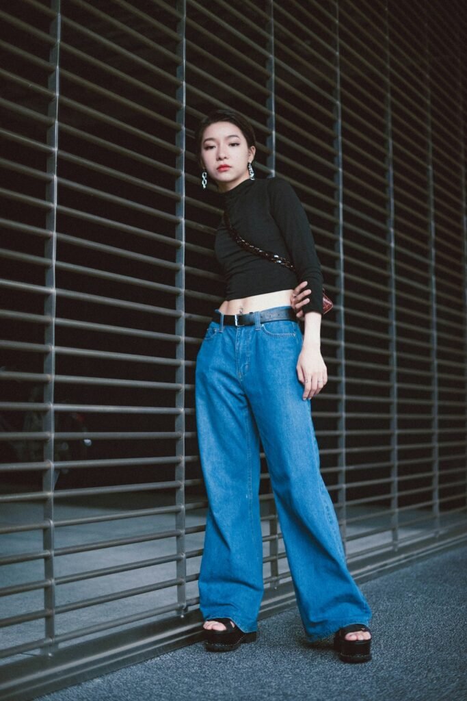 Woman in wide leg mid blue jeans