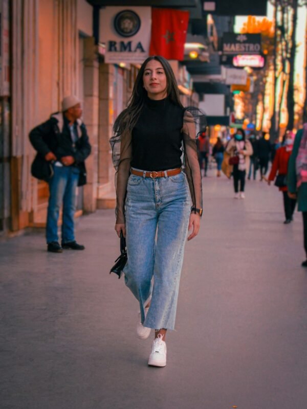 Woman in mid blue bootcut jeans