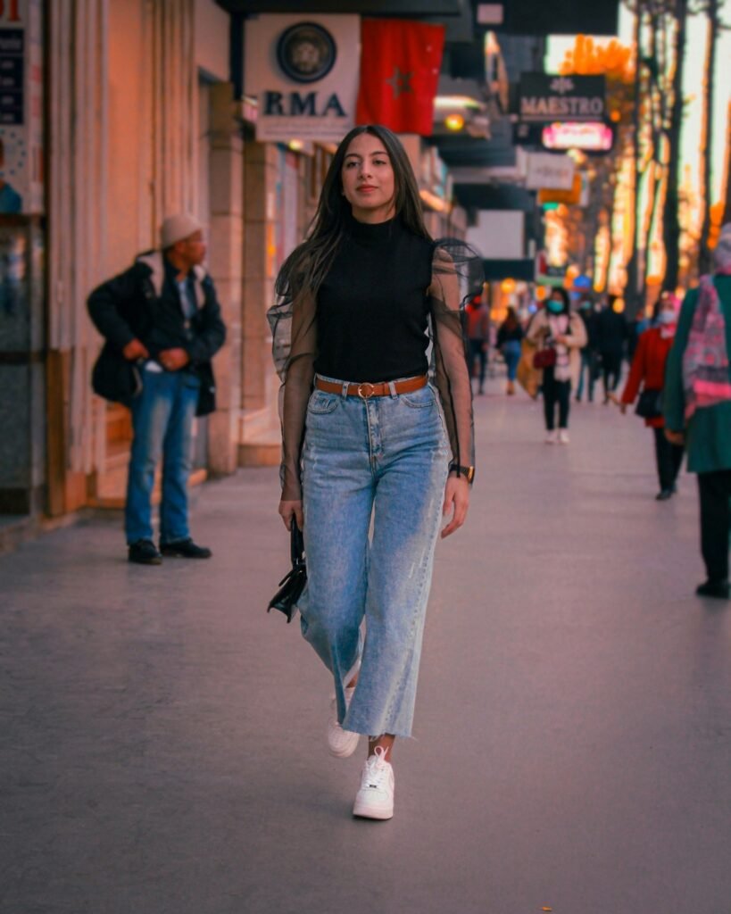 Woman in mid blue bootcut jeans